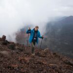 person hiking sustainable landscape