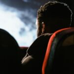 person watching sports on TV