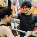 personal trainer working with client